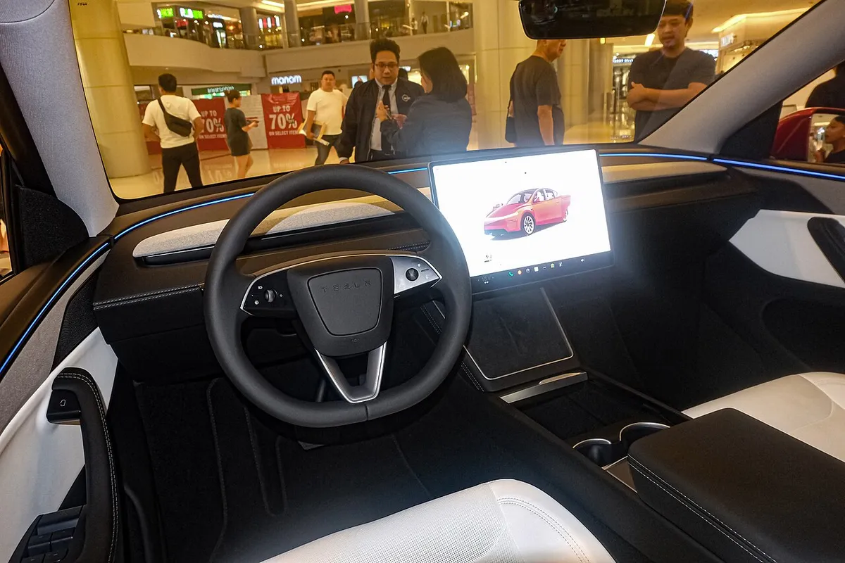 The white and black interior of a Tesla Model Y Juniper Long Range AWD